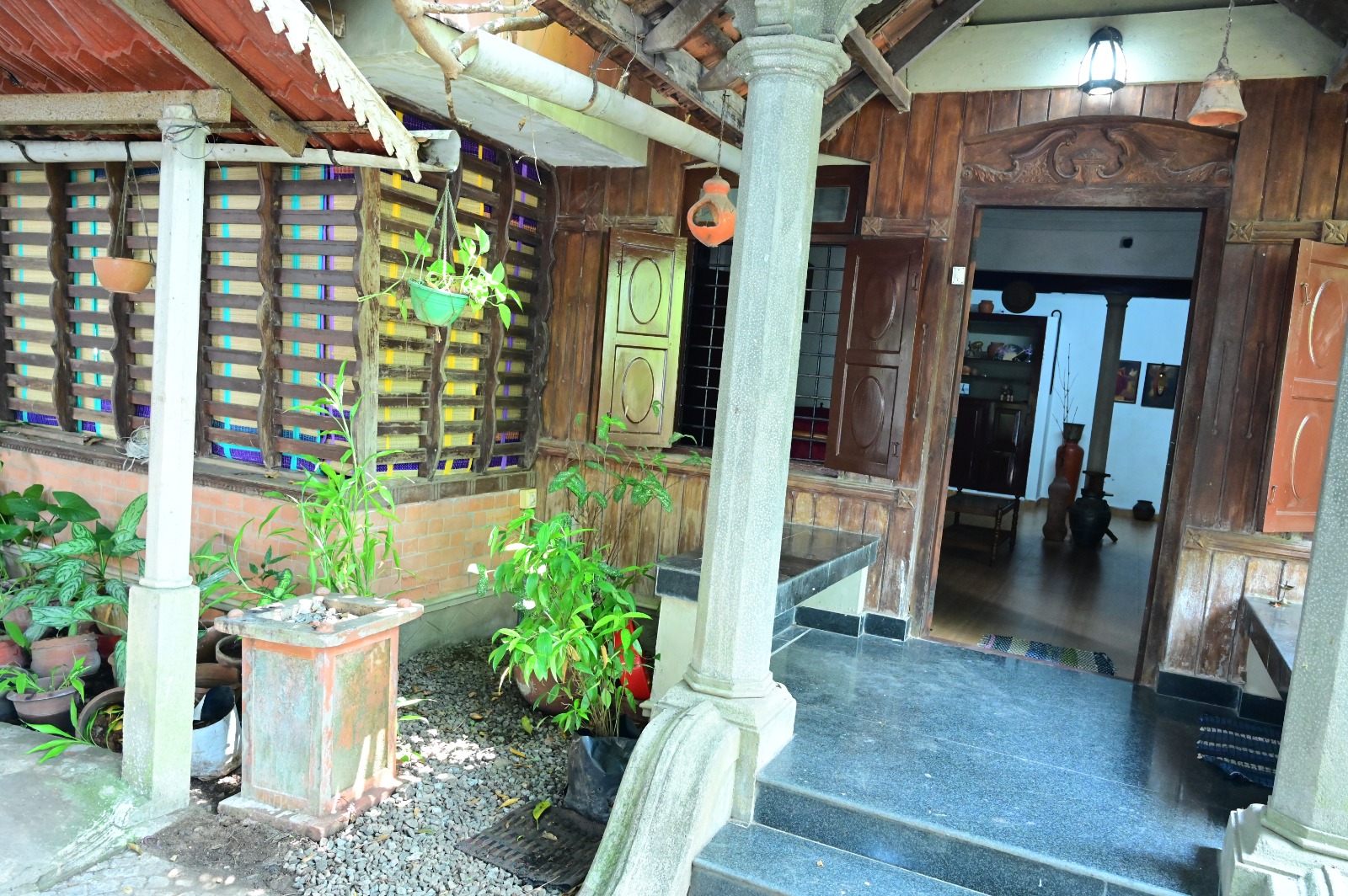 Traditional Kerala entrance with stone pillars